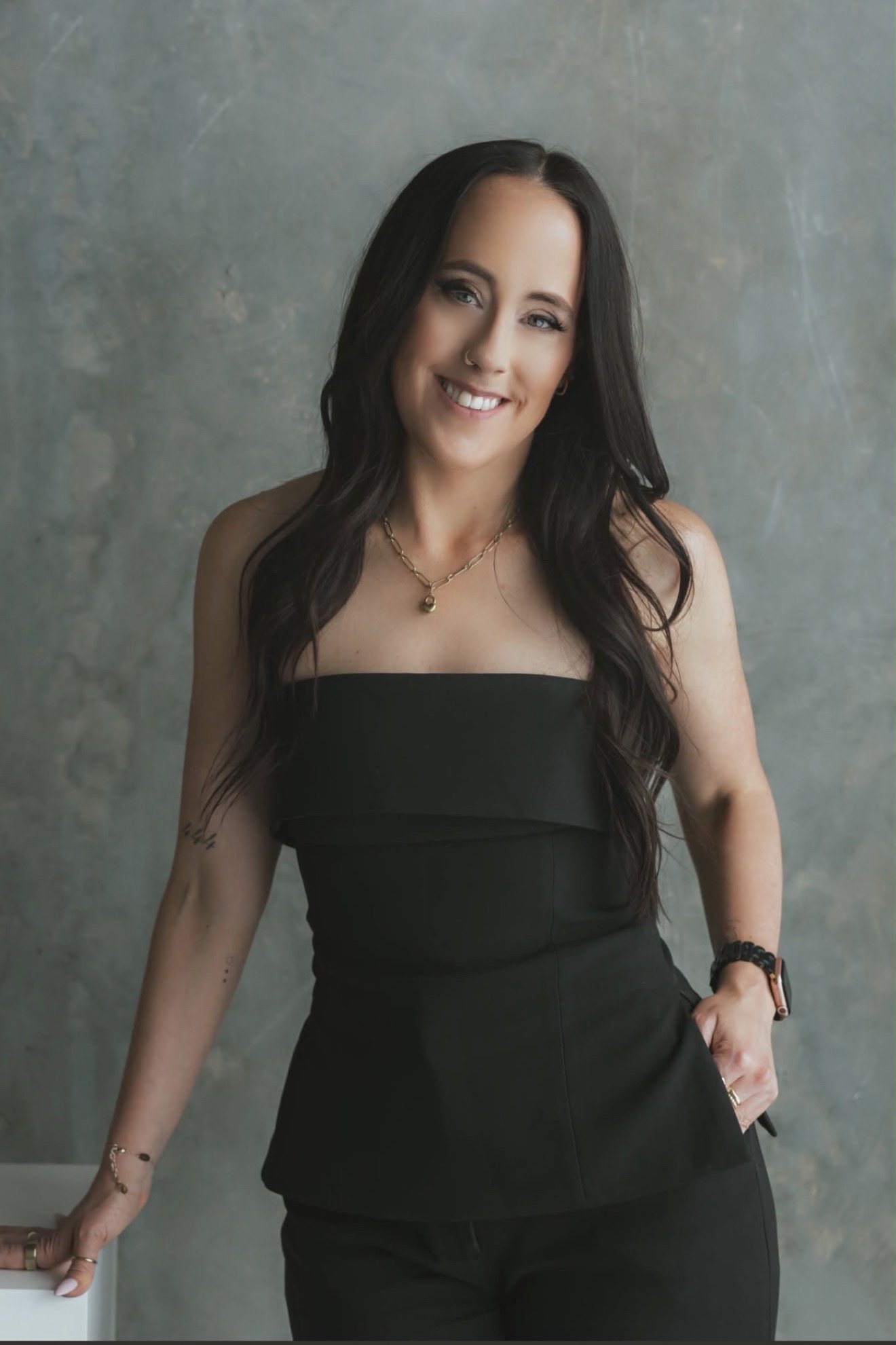 Sarah smiling in black outfit